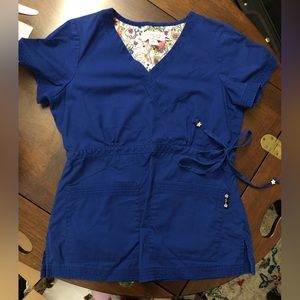 Cute blue scrub top with bow on side size XS